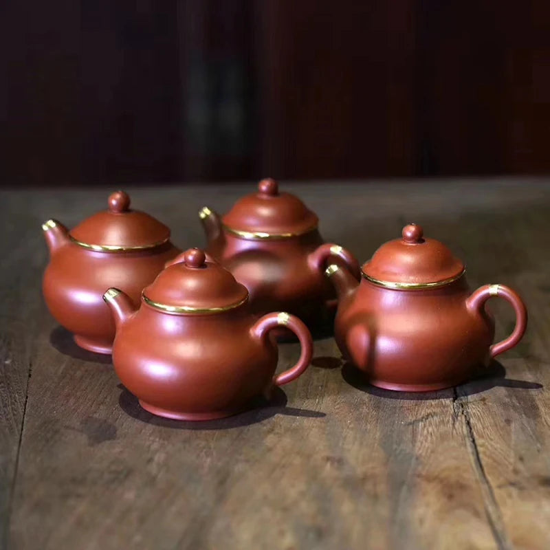 Yishuitang Yixing raw ore pure handmade purple clay pot family small coal mine vermilion clay pot bag 24K gold 180ml