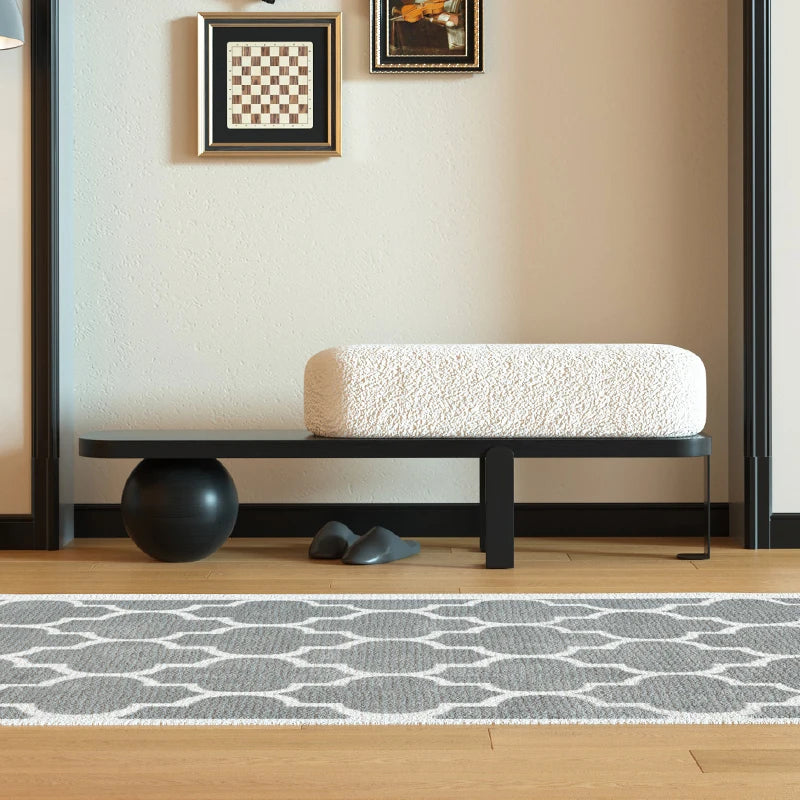 A simple and luxurious long bench at the entrance of a household, with a wooden color at the end of the bed