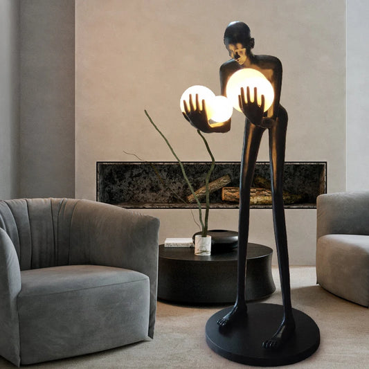 Nordic humanoid sculpture floor lamp creative ball holding designer exhibition hall, hotel sales office, character decoration st