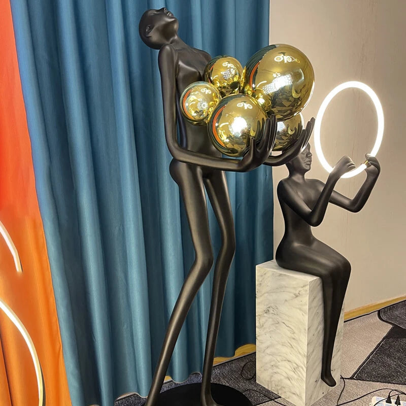 Nordic humanoid sculpture floor lamp creative ball holding designer exhibition hall, hotel sales office, character decoration st