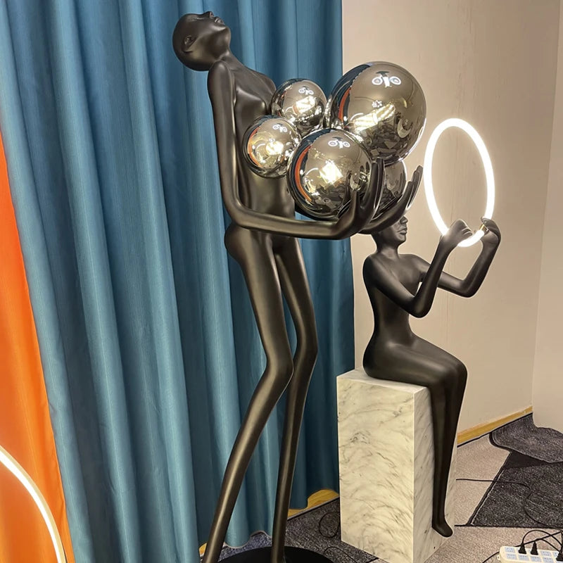 Nordic humanoid sculpture floor lamp creative ball holding designer exhibition hall, hotel sales office, character decoration st