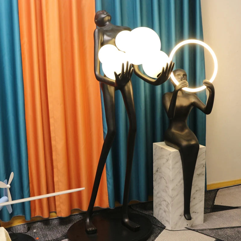 Nordic humanoid sculpture floor lamp creative ball holding designer exhibition hall, hotel sales office, character decoration st