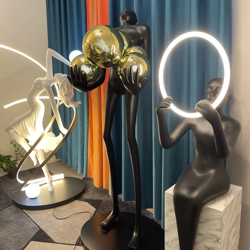 Nordic humanoid sculpture floor lamp creative ball holding designer exhibition hall, hotel sales office, character decoration st