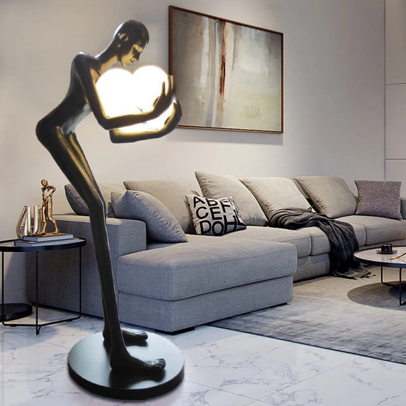 Nordic humanoid sculpture floor lamp creative ball holding designer exhibition hall, hotel sales office, character decoration st