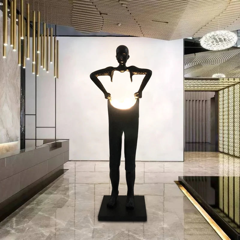Nordic humanoid sculpture floor lamp creative ball holding designer exhibition hall, hotel sales office, character decoration st