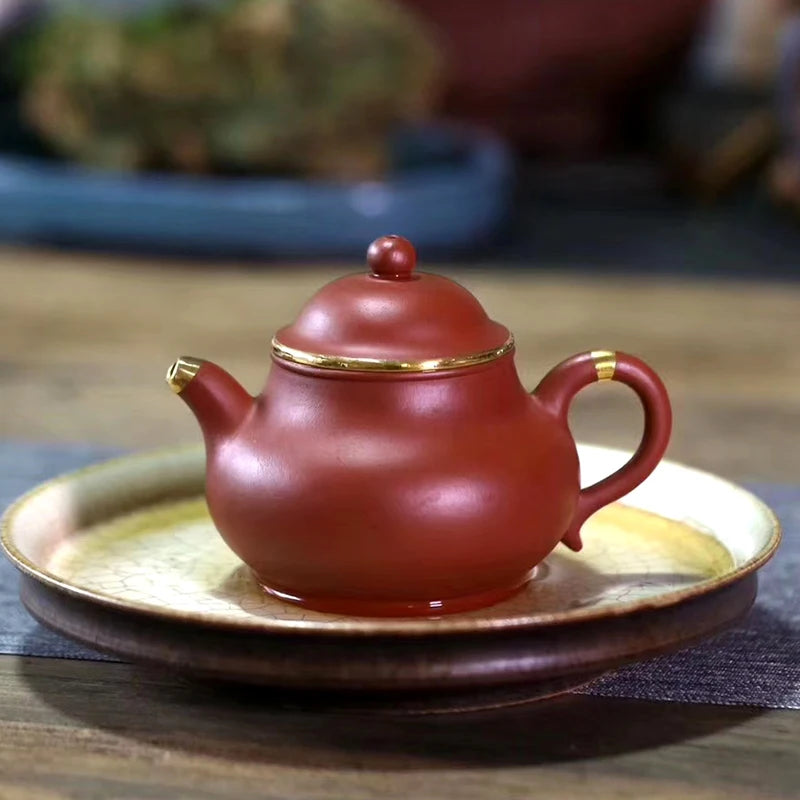 Yishuitang Yixing raw ore pure handmade purple clay pot family small coal mine vermilion clay pot bag 24K gold 180ml
