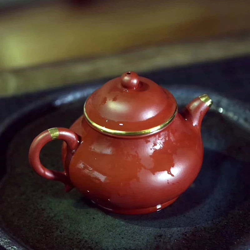 Yishuitang Yixing raw ore pure handmade purple clay pot family small coal mine vermilion clay pot bag 24K gold 180ml